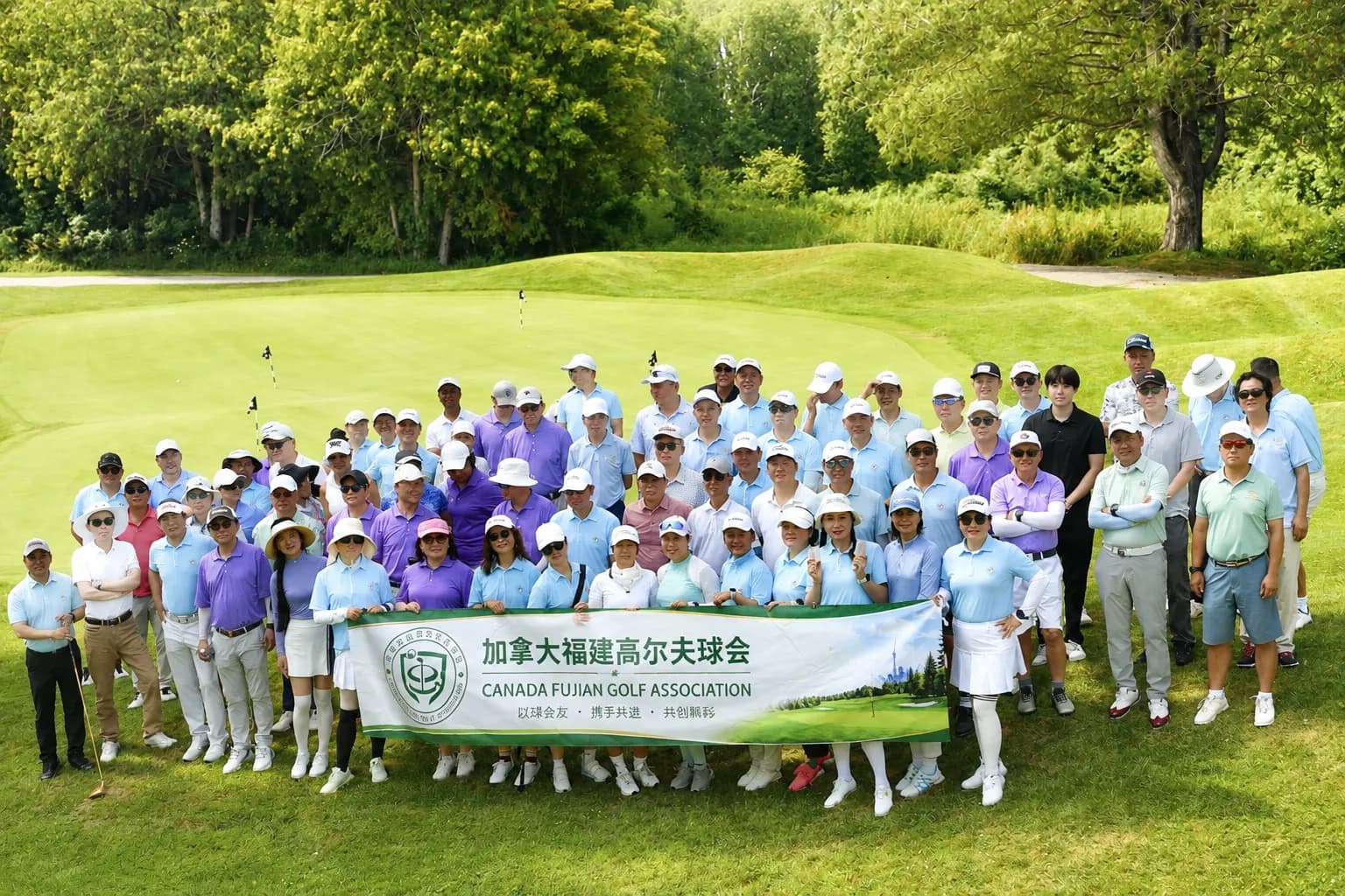 CFGA members gathered on the fairway with the club banner