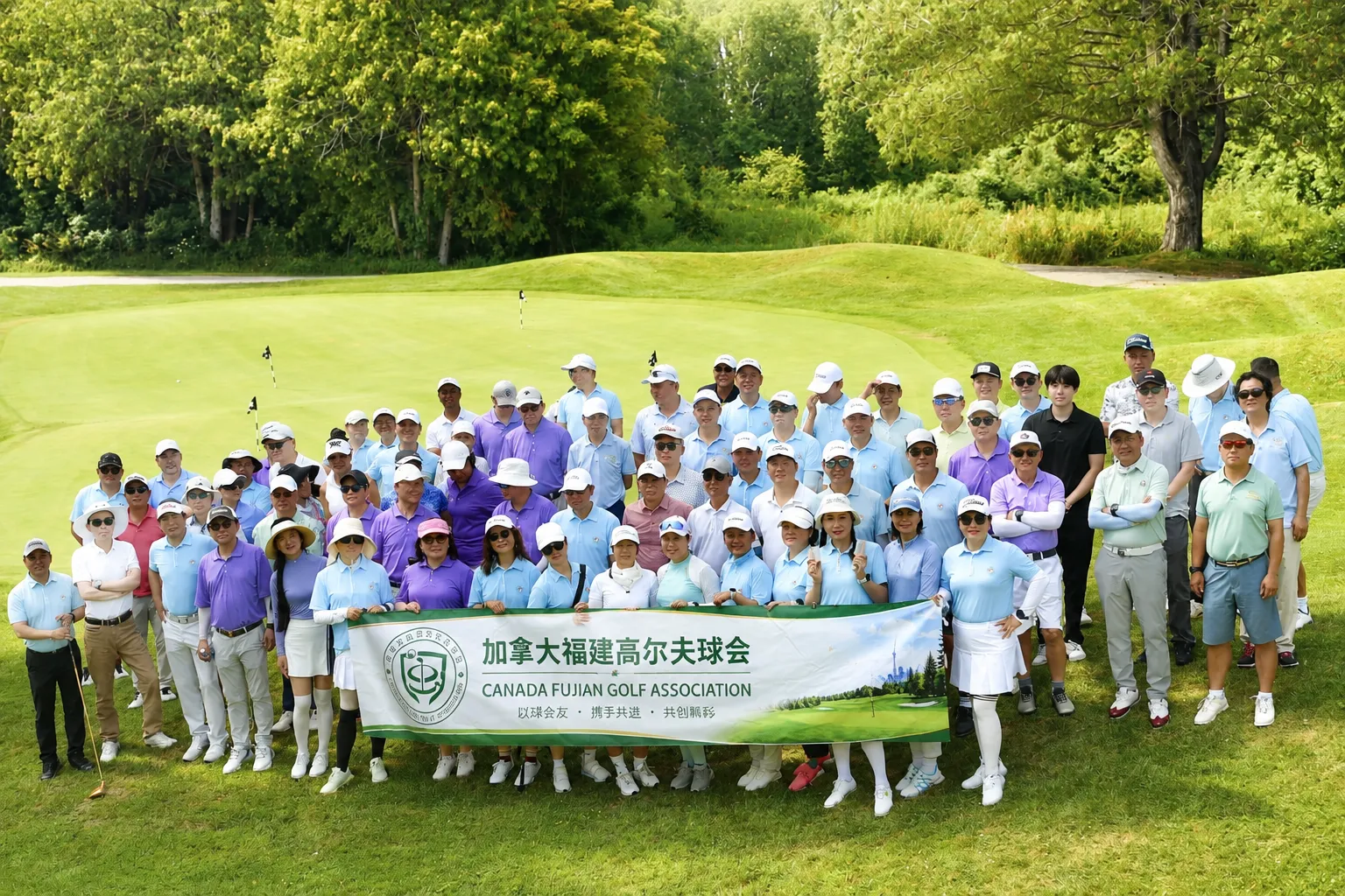 CFGA members gathered on the fairway with the club banner